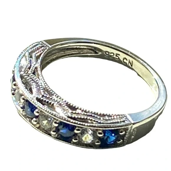 Sterling silver band with blue and white sapphire stones. - Picture 2 of 4